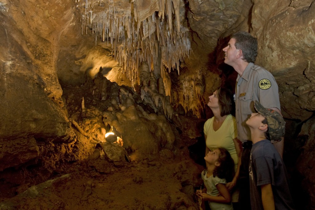 family looking at cave walls